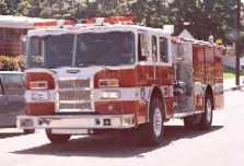 An El Segundo City Fire Engine driving north on Center Street near the school.